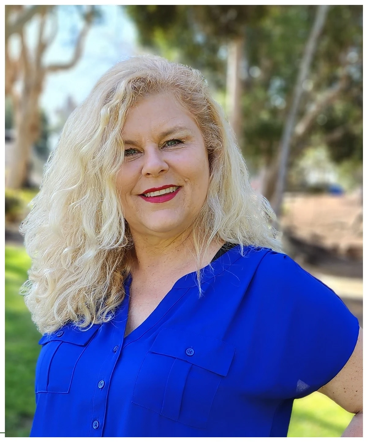 Lisa McCarthy outdoors wearing a royal-blue blouse