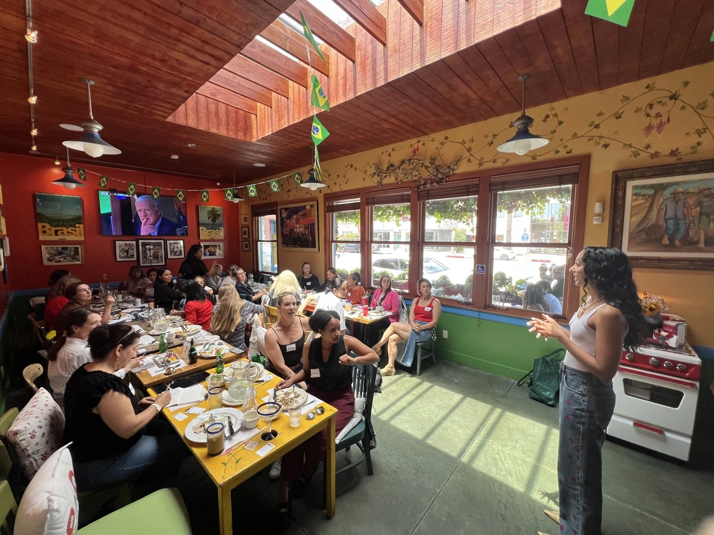A woman addressing an engaged community gathering